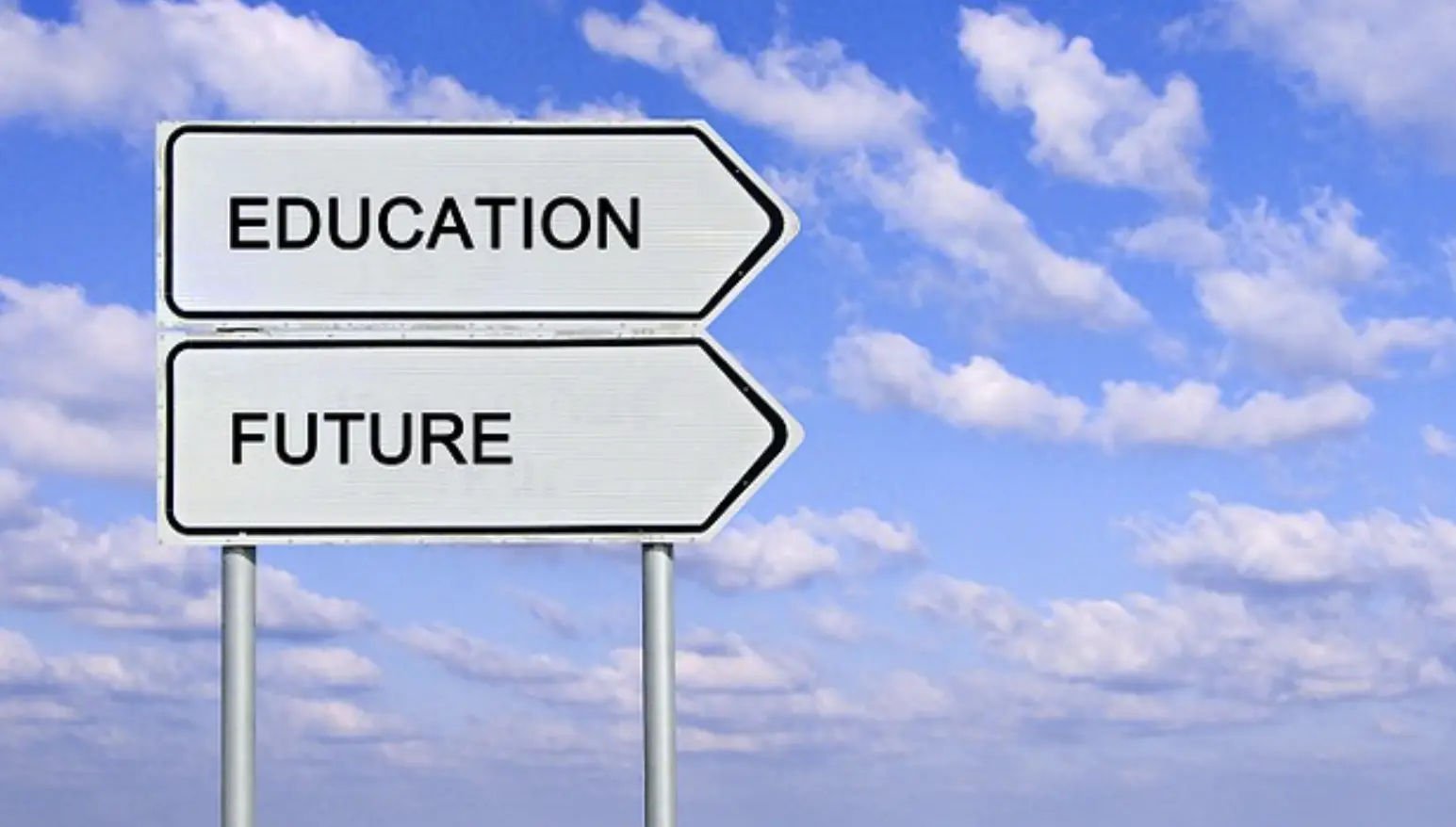 Photo of two white signs pointing to the right that say