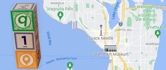 Wooden building blocks on a map