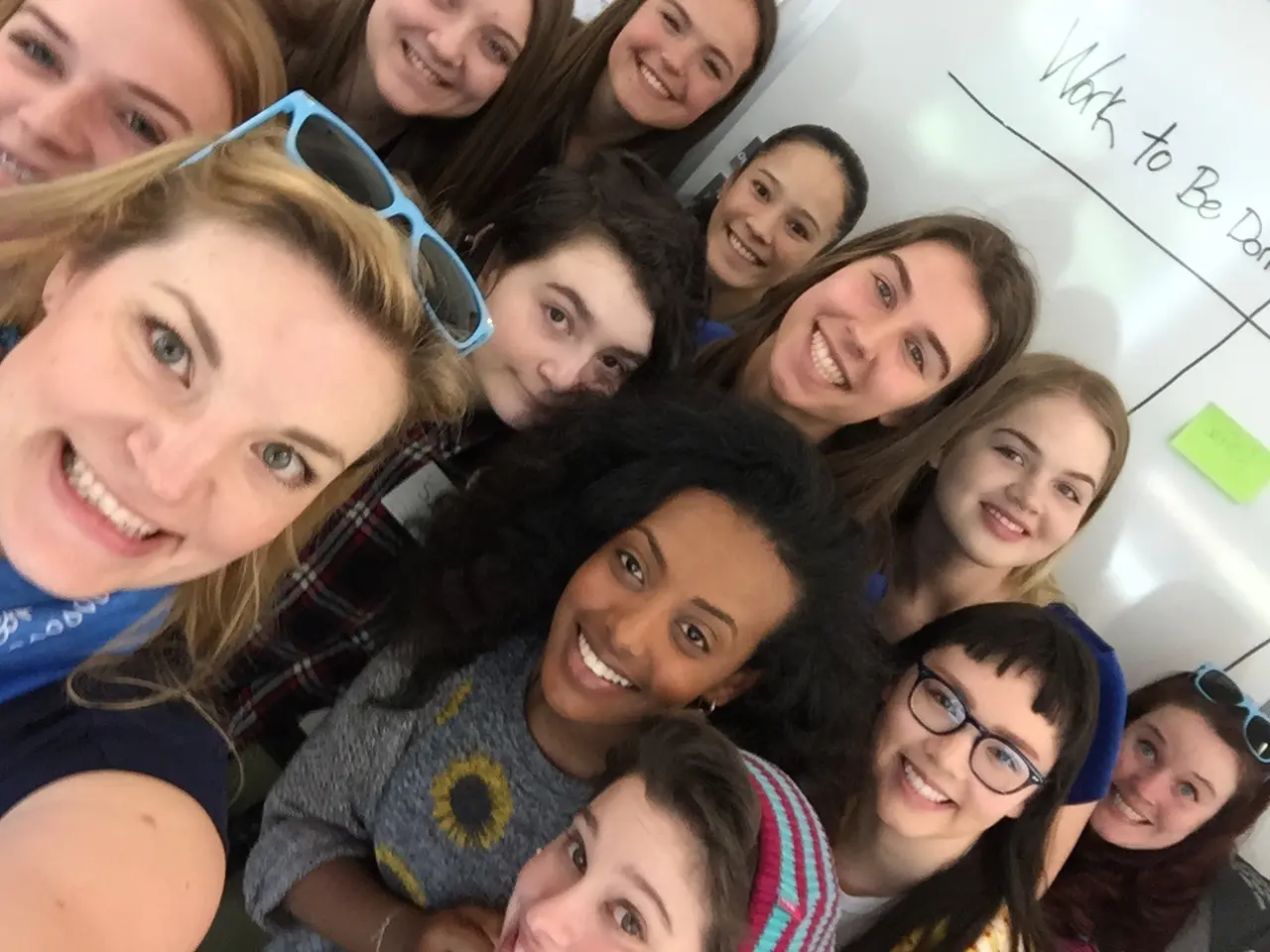 Sarah Bird taking a selfie with some Moz co-workers.